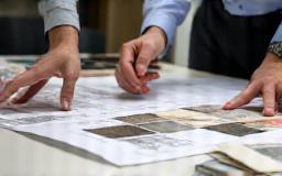 Architects reviewing tile samples and plans